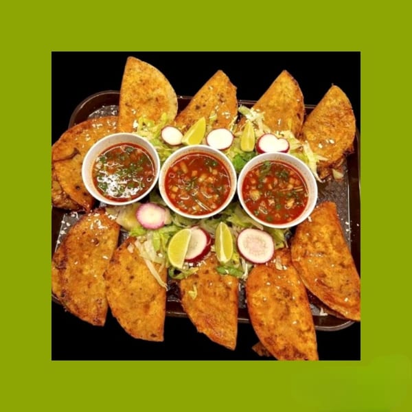 A tray of La Familia Callejas Mexican Food birria tacos with consommé, radishes, and limes.